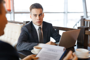 Man wearing suit in business meeting